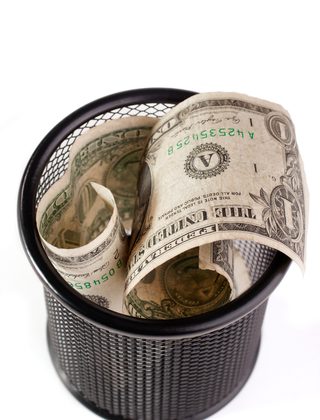 © Yurchyk | Dreamstime.com - Dollars In A Trash Bin Photo