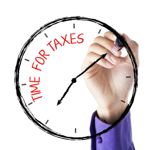 http://www.dreamstime.com/royalty-free-stock-photography-hand-writing-time-taxes-hands-marker-face-clock-image36872907